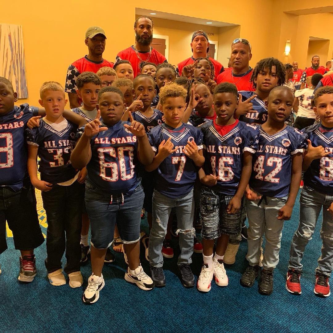 All Star team of young athletes and coaches together in showcase jerseys